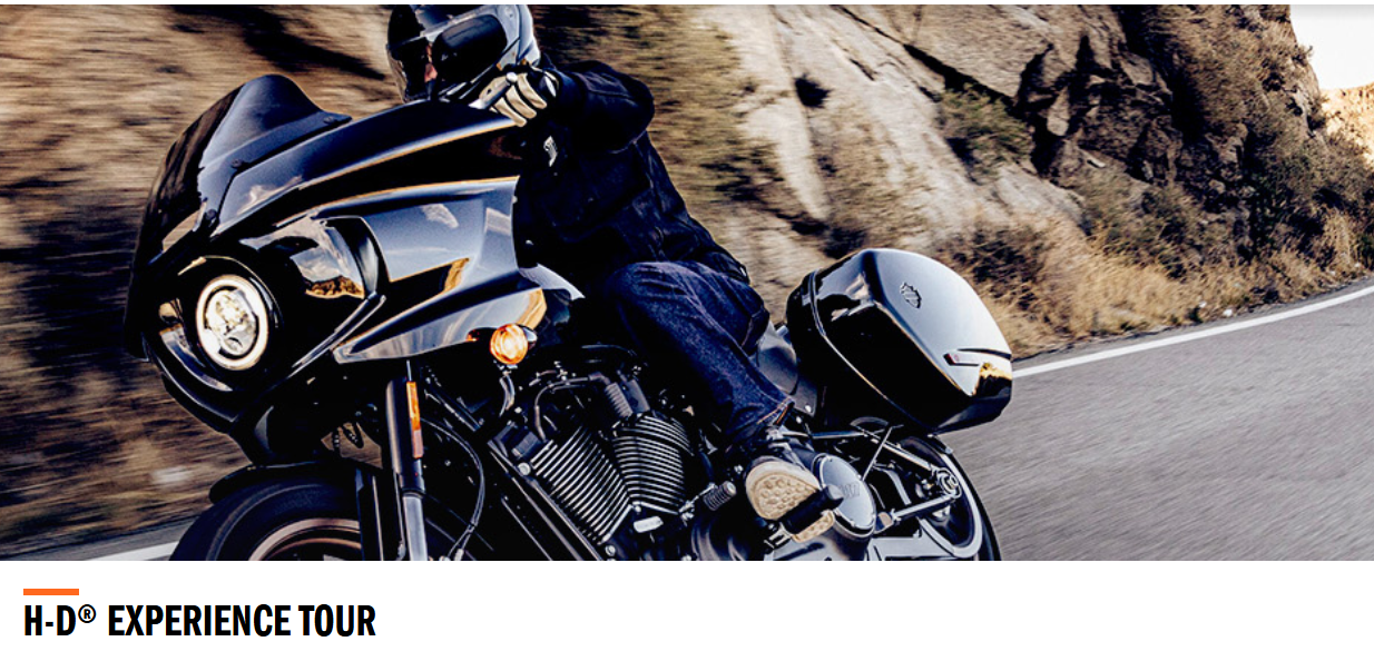 Harley Davidson Experience Tour Motorradfahrer auf kurvenreicher Straße
